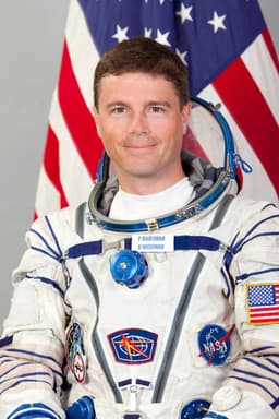 Reid Wiseman in spacesuit, smiling